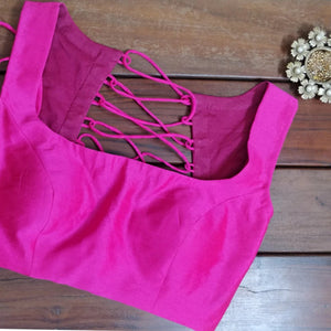 Hot pink sleeveless croptop.