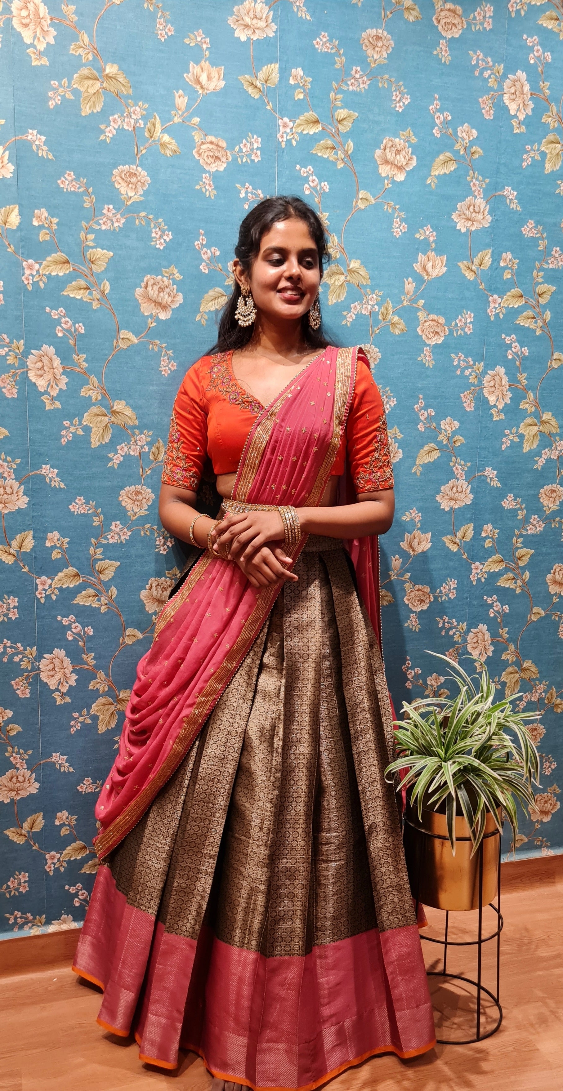 In a pink color saree, elbow length sleeve blouse design and hip