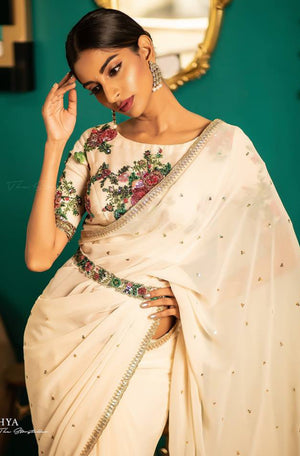 Off White Saree with heavy Embroidered Blouse